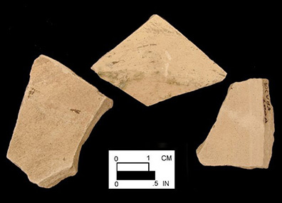 Probable yellow border ware of indeterminate vessel form. Unglazed exterior (bottom) base and body sherds from 18CV83.