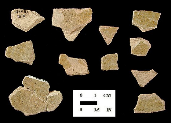 Possible Border Ware of indeterminate hollow vessel with unglazed exterior and yellowish green lead glazed interior on a pink paste from King's Reach Site 18CV83/213B.