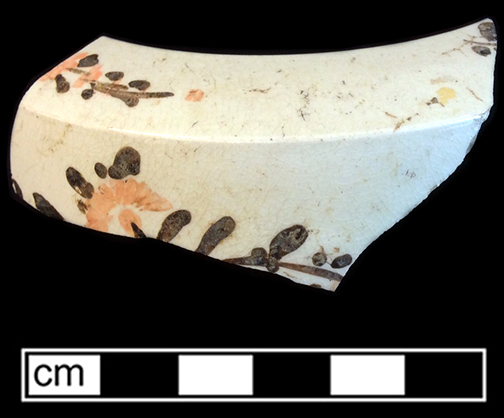 Creamware painted overglaze enamel teapot. Lot:17, Provenience:1HX.592.7, Privy Stratum 4. 18BC38