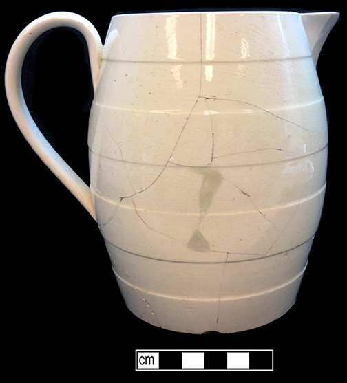 Creamware jug/pitcher, molded horizontal bands. Rim diameter: 4.00&rdquo;, Base diameter: 4.00&rdquo;, Vessel height: 6.25&rdquo;. Lot: 47D 339-2. 18BC50.