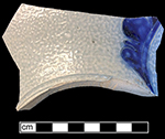 Gray-bodied salt glaze stoneware unidentified hollow vessel with engraved (incised) foliage motifs and cobalt-blue painted decoration under the glaze, from 18CV60. 