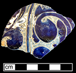 Gray-bodied salt glaze stoneware unidentified hollow vessel with engraved (incised) foliage motifs and cobalt-blue painted decoration under the glaze, from 18CV60.