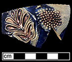 Gray-bodied salt glazed stoneware mug or jug with applied blossoms and flowers and engraved stems. Cobalt-blue and manganese under the glaze from 18CV60. Probably similar to vessel shown to the right from private collection. Vessel probably dates to second half of 17th century, based on the applied and incised motifs with cobalt blue and manganese.