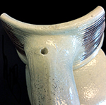 Gray-bodied salt glazed stoneware jug with concentric rilling with manganese decoration under the glaze.  Terminus of the strap handle is known as rat tail.   Lug hole at the top of the handle indicates the vessel once had a pewter or brass lid from 18CV60 Angelica Knoll.
