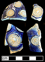 Gray-bodied salt glazed stoneware hollow vessel fragments showing different prunt motifs.&nbsp;Applied prunts outlined with cobalt-blue under the glaze. Similarly decorated vessels in printed sources dated c. 1680 from 18CV60.