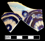 Gray-bodied salt glazed stoneware  unidentified hollow vessel (probable jug) with incised foliage and stamped rosettes outlined with cobalt-blue under the glaze. Lot number: 18CV60 1.441 and 1.442.