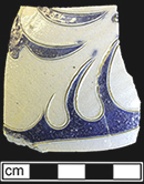 Gray-bodied salt glaze stoneware hollow (jug?) with engraved (incised) foliage outlined in cobalt-blue under the glaze, from 18CV60.