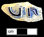 Gray-bodied salt glazed stoneware hollow (jug or chamberpot) with applied round medallion molded with crowned GR cipher of King George I (1714-1727) or King George II (1727-1760).  