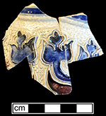 Gray-bodied salt glazed stoneware jug or mug with applied  tulips.  Cobalt-blue and manganese under the glaze. Vessel diameter 4.0&rdquo; to 4.5&rdquo;.  Vessel probably dates to second half of 17th century, based on the applied and incised motifs with cobalt blue and manganese.