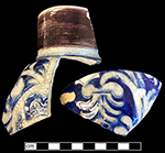Gray-bodied salt glazed stoneware jug with concentric rilling with manganese  around vessel neck.  Applied seal or medallion of indeterminate design and incised foliage outlined in cobalt-blue under the glaze.  Strap handle. 3.25&rdquo; rim diameter. Lot numbers:18PR175-5.2264, 5.2574, 5.2633, 5.2912.
