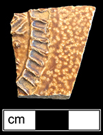 German brown salt glaze stoneware Bartmann bottle with iron oxide slip. Unidentified fragmented medallion, from 18CV60. 