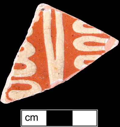 North Midlands reverse slip decorated flat vessels of indeterminate form. Interior of vessel covered with red slip with white slip trailed decoration applied over red slip. Glazed interiors, unglazed exteriors - Collected by George L. Miller in 1986 in Staffordshire, England.