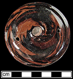 This thrown agateware teapot lid clearly shows the spiraled effect of the different clays, created by forming the vessel on a potter&rsquo;s wheel - George L. Miller Collection at the Maryland Archaeological Conservation Laboratory.  Gift from David Barker.
