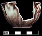 Tortoiseshell cream colored earthenware cup in common or Chinese shape. Rim diameter: 3.25&rdquo;; Base diameter:  1.50&rdquo;; Vessel height:  1.75&rdquo;, from 18QU124.