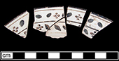 Saucer painted overglaze in red and brown from 18BC27.