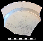 Creamware plate with scalloped rim. Rim diameter: 9.50”. Lot 181-29. Note cutlery scratch marks in the plate well. 18BC66.