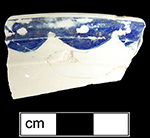 Overglaze painted scalloped border motif in blue.&nbsp;Probable tureen lid from HanleySite-Staffordshire England.