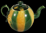 Melon shaped teapot with rouletted lines, glazed in a combination of green and yellow - from a private collection.