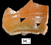 North Devon Gravel-Tempered Coarse Earthenware Pipkin. Unglazed exterior and glazed interior, 3 legged. While this site is conservatively dated c. 1660-1700, it is likely the assemblage represents the household of Henry Hosier, merchant, who occupied the site c. 1671-1686.
