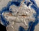 Gray-bodied salt glazed stoneware chamberpot  with applied rampant lion and stamped rosettes outlined in cobalt-blue  under the glaze.  Cordoned rim and base. Rim diameter. 6.70&rdquo;; Base diameter: 5.50&rdquo;; Vessel height:  5.75&rdquo;; Object ID: 2602.
