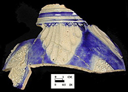 Gray-bodied salt glaze stoneware jug  with applied (sprigged) floral motifs with cobalt blue painted under the glaze.  Cordoned neck and gadrooned below the neck. Lot numbers: 18CV271-27, 83, 89, 126, from 18CV271.