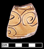 North Devon Sgraffito dish with incised repeating spiral (curlicue) motif along rim.  White slip over red earthenware body, with lead glazed interior, Lot 8.  Rim motif similar to Vessel 26 depicted in Grant (1983), from a context of circa 1665. 