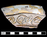 North Devon Sgraffito dish/pan with incised spiral (curlicue) motif. White slip over red earthenware body, with lead glazed interior. Approximately 11&rdquo; rim diameter. Lots  165, 194. Rim incised motifs similar to Vessel 26 depicted in Grant (1983), from a context of circa 1665 and to examples from a circa 1670-1680 context at Jamestown, Virginia.