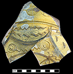 North Devon Sgraffito dish. White slip over red earthenware body, with lead glazed interior. Incised geometric motif. Approximately 12” rim diameter. Lots 9, 91, 153, 176. Similar to geometric motif vessel shown in Figure 20 (Outlaw 2002).