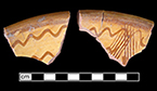 North Devon Sgraffito dish. White slip over red earthenware body, with lead glazed interior.  Incised repeating sine wave motif.  9&rdquo; rim diameter. Lots 2, 8, 93.