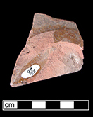 North Devon Sgraffito probable dish with incised motif, probably floral. White slip over red earthenware body, with lead glazed interior. Most of the lead glaze has been worn away from this vessel, exposing the white slip.  Lot 136.