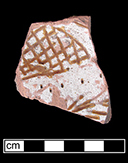 North Devon Sgraffito probable dish with incised motif, probably floral. White slip over red earthenware body, with lead glazed interior. Most of the lead glaze has been worn away from this vessel, exposing the white slip.  Lot 136.