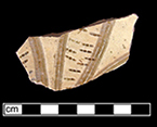 North Devon Sgraffito probable dish with incised motif, probably floral.  White slip over red earthenware body, with lead glazed interior.  Lot 100.