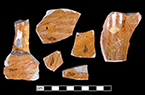 North Devon Sgraffito jug with incised spiral (curlicue) and linear motifs. White slip over red earthenware body, with lead glazed interior.  Vessel 34. Lots 601, 636, 720, 725.