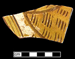 North Devon sgraffito dish/bowl with white slip over red earthenware body and lead glazed interior-Lots 185, 241. Image courtesy of Naval Air Station Patuxent River, Naval District Washington DC.