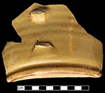 North Midlands slip decorated handled cup.&nbsp;Interior decorated with &ldquo;jeweled&rdquo; dots of slip typical of late 17th- and early 18th-century vessels. Decorated in white and brown slip, Glazed interior (left) and exterior (middle). Base diameter:&nbsp;5.75&rdquo; Lot 229. Paste shot shown on right - from 18CV169. 