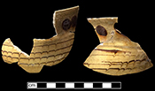 North Midlands slip decorated handled cup decorated with brown dots and combed decoration. Rim diameter: 5.00&rdquo;, M.V. #12, from 18PR175.