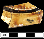 North Midlands slip relief-decorated press molded dish.   Relief molded pieces generally date from the late 17th to early 18th centuries (Grigsby 1993:39), Lot 23, from 18QU124.