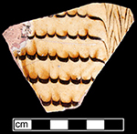North Midlands combed slipware flat vessel ( most likely a dish). Trailed and combed brown slip on white slip ground. Glazed interior and unglazed exterior - Collected by George L. Miller in 1986 in Staffordshire, England.