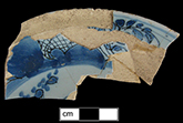 Plate painted in blue with probable Chinoiserie motif -  Probably dates to the second quarter of 18th century based on similar examples in Archer 1997).