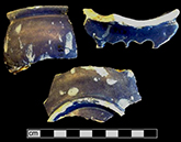 Porringer with Nevers or Persian Blue style decoration. Dark blue tinted glaze with decoration in white.