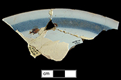 Plate with broad blue rim band.