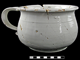 Mended undecorated chamberpot.