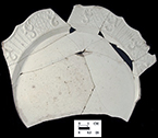 Molded plate rim with molded 'dot, diaper, basket'  pattern, close up on right.&nbsp;Antietam Furnace, 18WA288.