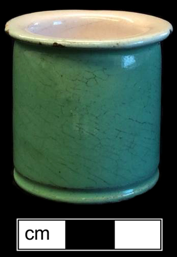 Nineteenth-century French ointment pot with white tin glazed interior and green tin glazed exterior. Rim diameter: 2.0&rdquo;; Base diameter: 1.75&rdquo;; Vessel height: 2.0&rdquo; - from 18BC33.