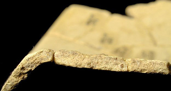 Rim sherd, paste only.