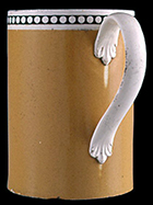 Solid color field slip quart mug with slip-inlaid rouletted band, c. 1800. 6 inches in height - Private collection.