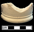 Mug. Unglazed bisque waster. Base diameter: 3.5”; 6.3 m thick. Printed mark for United States Marine Corps 1919 on underside of vessel.