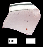 Shallow bowl (small baker?), rolled rim. Unglazed bisque waster. Painted green band and line. Rim diameter: 4.0”; 4.2 mm thick.