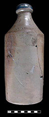 Grey-bodied salt glaze stoneware bottle originally used for beer, soda or root beer. Impressed “Dr. J. A. Brown” on shoulder and lip dipped in cobalt. Vessel height: 9.75”, Base diameter: 3.75”, Minimum Vessel 4, from 18BC27.