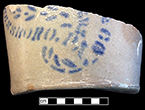 Grey-bodied salt glaze stoneware hollow vessel with stencilled cobalt motif. Base diameter: 5.75”, Vessel #:7. This vessel was made in Greensboro, Pennsylvania by James Hamilton Company, in business between 1850 and 1880 (Greer 1981:174). 18BC56
